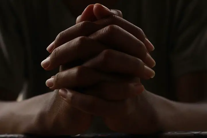 Praying with two hands together